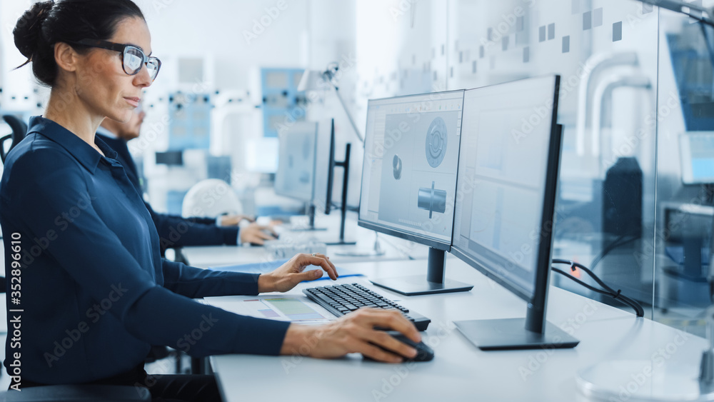 Aufkleber Industrial Engineer Solving Problems, Working on a Personal Computer, Using Mouse and Keyboard, Two Monitor Screens Show CAD Software with Machine Equipment in 3D.