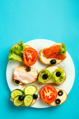 Set of assorted sandwiches on a blue background.