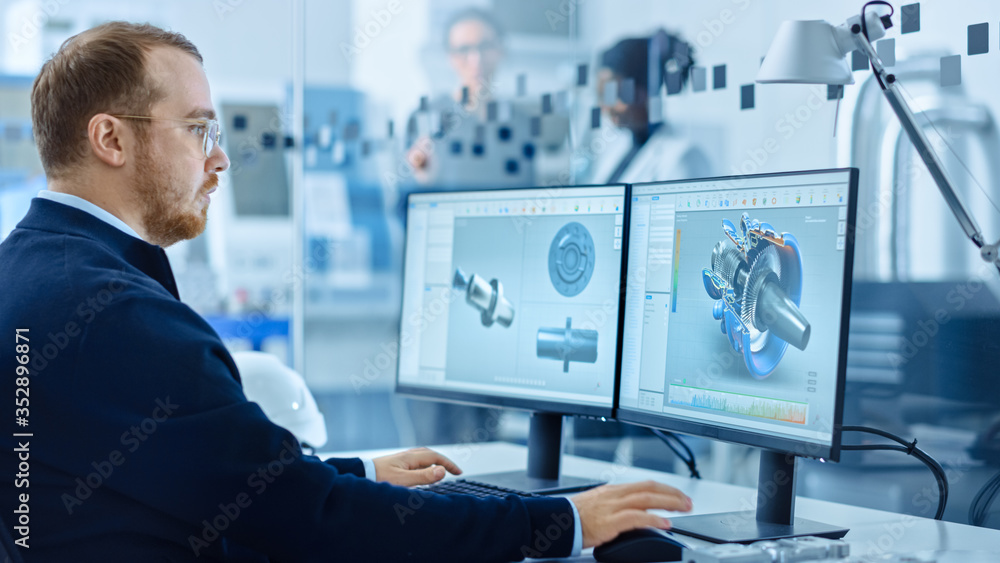 Poster Heavy Industry Engineer Working on Personal Computer, Screen Shows CAD Software with 3D Prototype of Zero-Emissions Engine. Industrial Factory with High-Tech CNC Machinery.