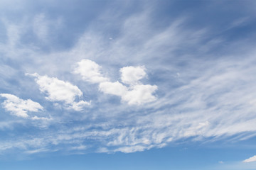 White cirrocumulus clouds in the blue sky. Beautiful sky background