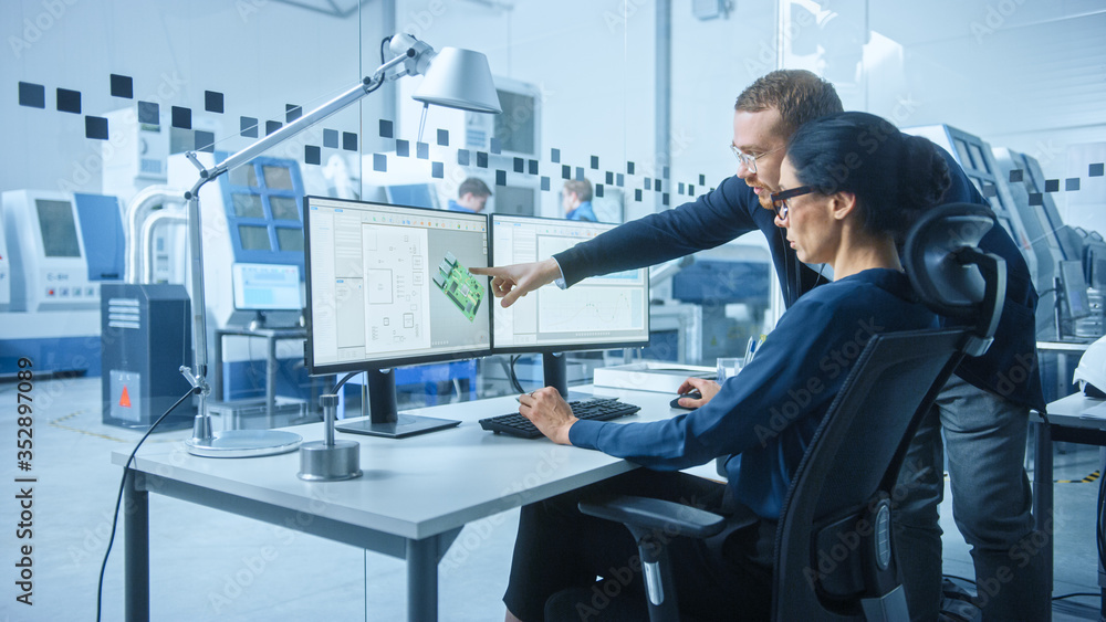 Poster modern electronics factory: male supervisor talks to a female electrical engineer who works on compu