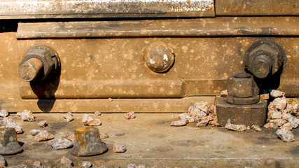 CLoseup photo of rusty connection between rail on old abandoned railroad