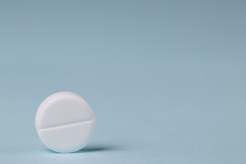 pills background, tablets on a blue background