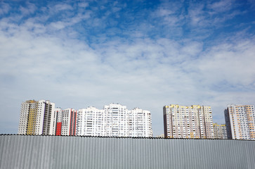 Modern East European residential apartment buildings quarter on a sunny day with a blue sky.Abstract architecture, fragment of modern urban geometry