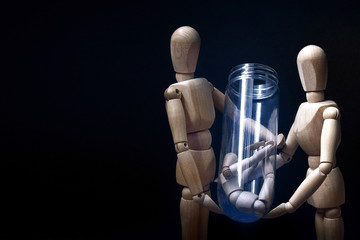 Mannequin parents looking at a baby IVF at lab. In vitro fertilization (IVF) concept.