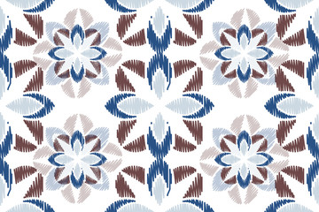 Colorful Ikat ornamentel seamless pattern for textile, wallpaper, card or wrapping paper. Tile for surface design