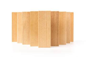 Domino effect, row of wood domino on white background