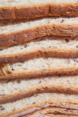 Slices of brown bread in a stack and close up