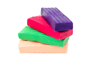 Group of colorful plasticine isolated on white background