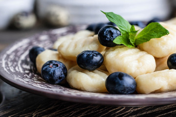 Lazy cottage cheese dumplings with fresh berry. Simple and healthy breakfast