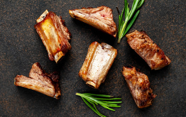 Grilled pork ribs on stone background