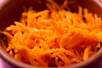 close up of tasty carrot in bowl