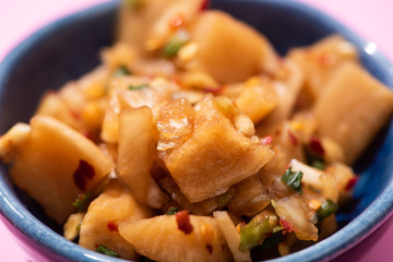 close up of traditional korean dish with braised potatoes in bowl