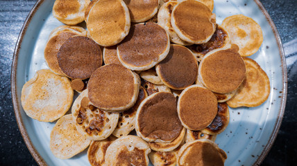 Traditional Dutch Mini Pancakes without any other ingredients with the black background