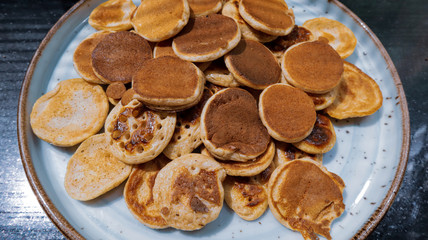 Traditional Dutch Mini Pancakes without any other ingredients with the black background