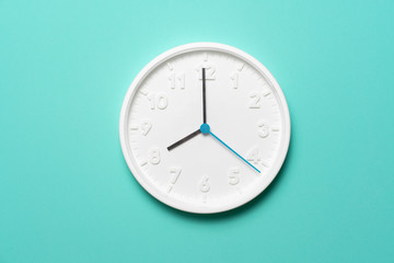 Retro clock on green table background, vintage style