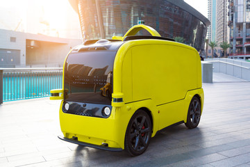 Self-service store on wheels a city street. Electric drone car selling food and drinks on a city...