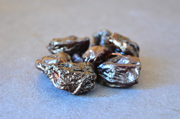 prunes on a black background