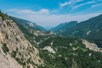 A picturesque landscape view of the valley of Var in the Alps mountains on a sunny summer day (Puget-Theniers, Alpes-Maritimes, France)