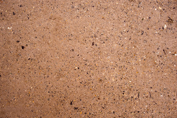 The texture of a cement wall with crumbs of stones. Structure.