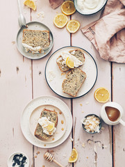 Slice lemon cake on a wood surface