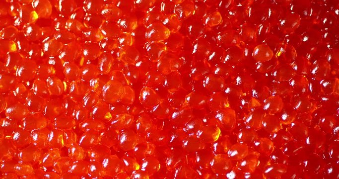 A lot of red caviar on the table.