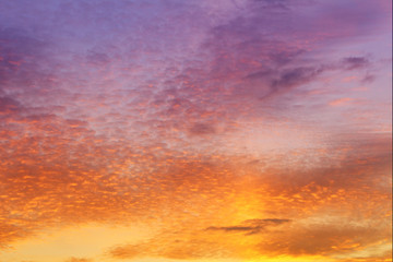 Fototapeta premium Evening sky and clouds. Orange and blue sky background. Spindrift clouds.