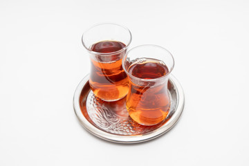 Turkish tea in traditional glass on silver tray