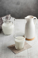  Glass of milk, jug of milk. The concept of milk, dairy products, agricultural products. Minimalism. Copy space.