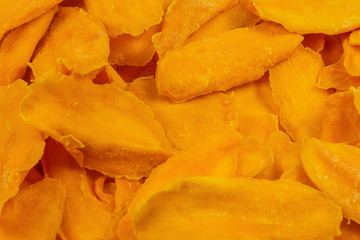 Tasty sugar mango slices background. Top view.
