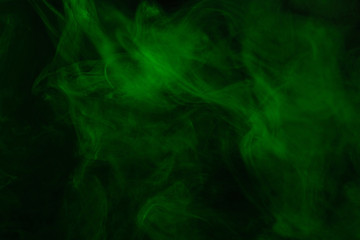 Green steam on a black background.