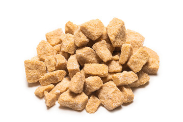 Brown sugar pieces isolated on white