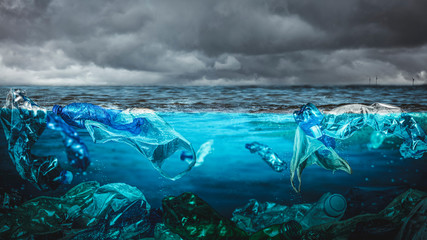 plastic bottles and waste of various kinds underwater in the sea.