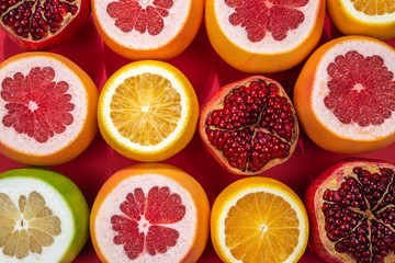 Fototapeta na wymiar Juicy grapefruit, orange, pomegranate, citrus sweetie