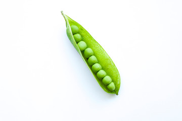 Fresh green peas isolated on a white background