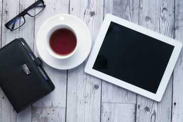 Top view of digital tablet with screen on desk 