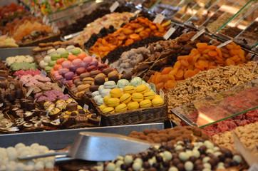 Sweet and chocolate stall in the food market in Barcelona, Spain, Mercado de La Boqueria.