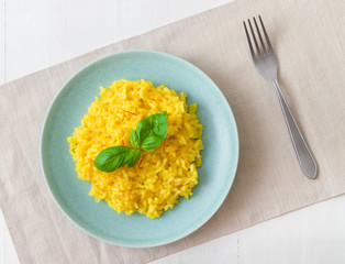 Risotto Milanese, the dish with traditional Italian saffron risotto. Top down view.