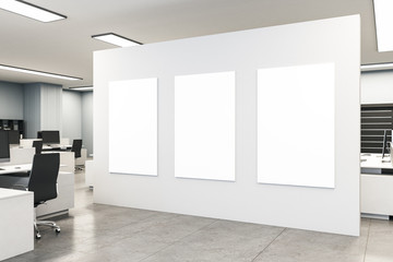 Coworking office interior with three blank billboards