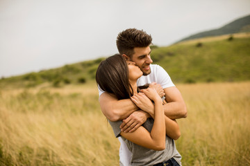 Young couple in love outside in spring nature