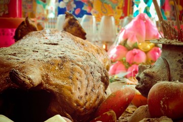 A back view of a cooked pig
