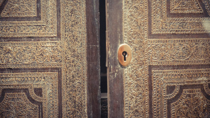 A close up engraved wooden  double door