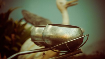 A close up of  silver bowls on stand
