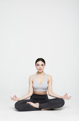Fototapeta premium young woman working yoga exercise, over white background