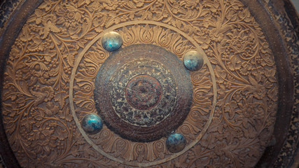 A close up of detail engraved wood