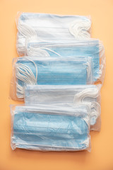 packaging of medical masks for face protection
Transparent packaging with medical masks for adults on an orange background