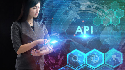 Business, Technology, Internet and network concept. Young businessman working on a virtual screen of the future and sees the inscription: API