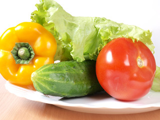 Red tomato sweet peppers on a plate. Ingredients for cooking