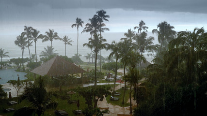 Photo of heavy rain and strong wind during typhoon at hotel resort on tropical island in Indian...