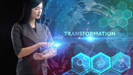 Business, Technology, Internet and network concept. Young businessman working on a virtual screen of the future and sees the inscription: Transformation